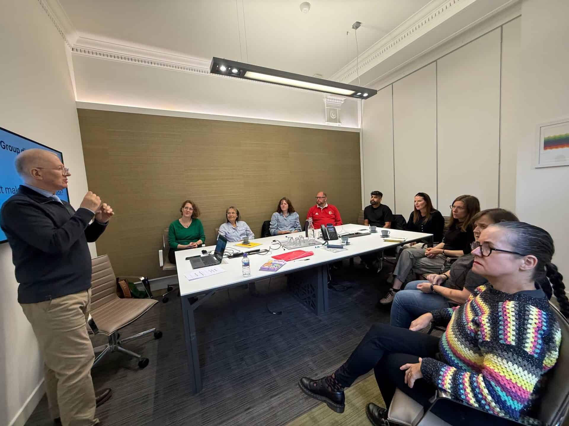 Group of people attending a meeting about the BSL (Scotland) Act 2015.