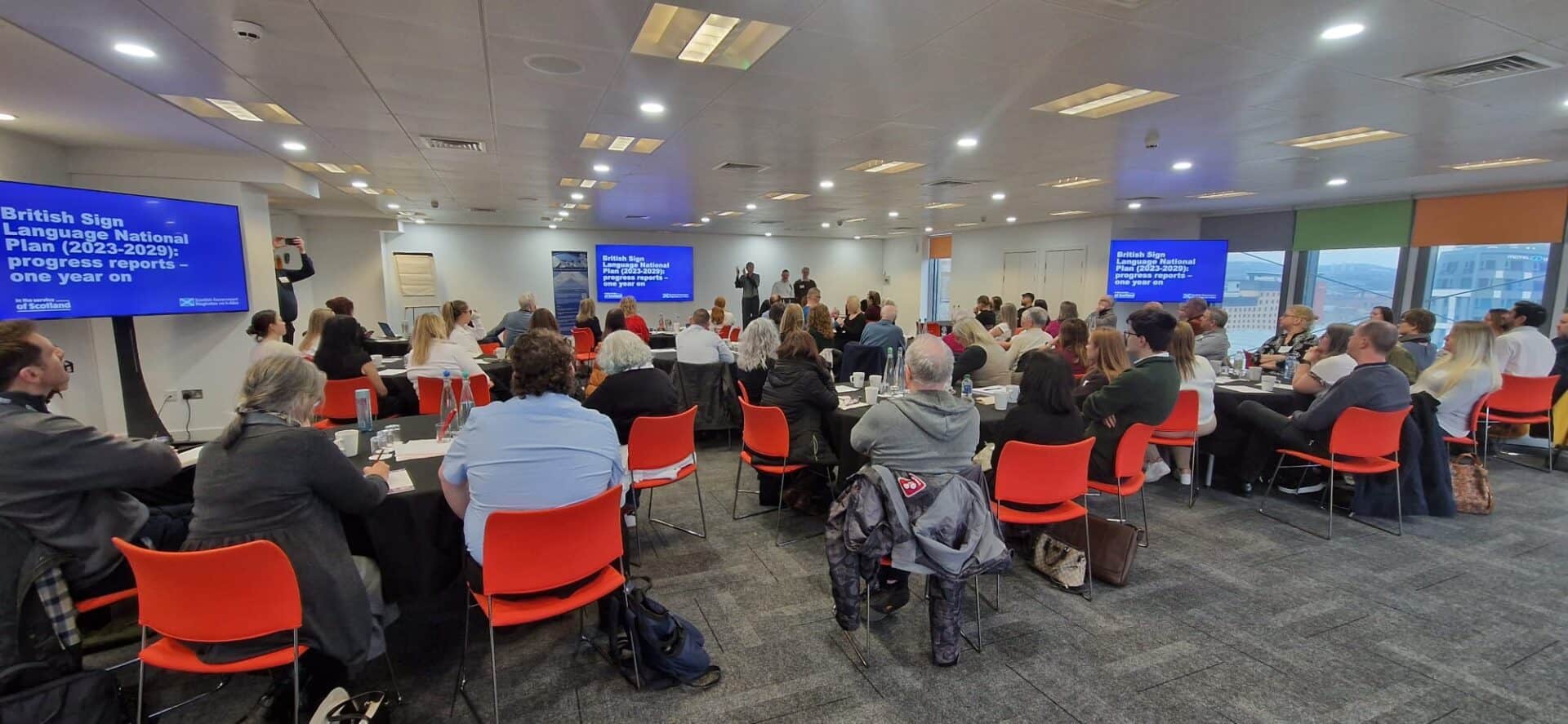 Attendees at a conference discussing the BSL (Scotland) Act 2015.